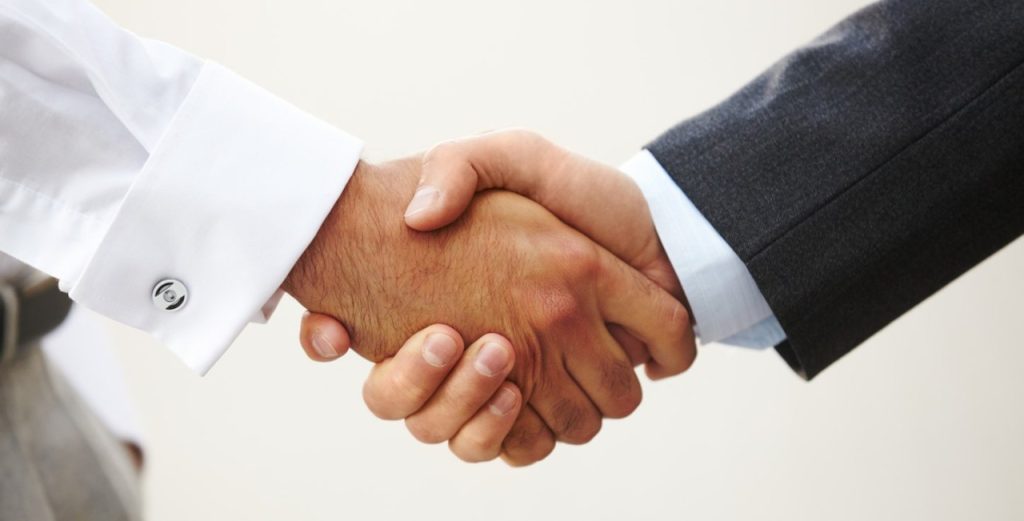 Two people shaking hands in Boston MA